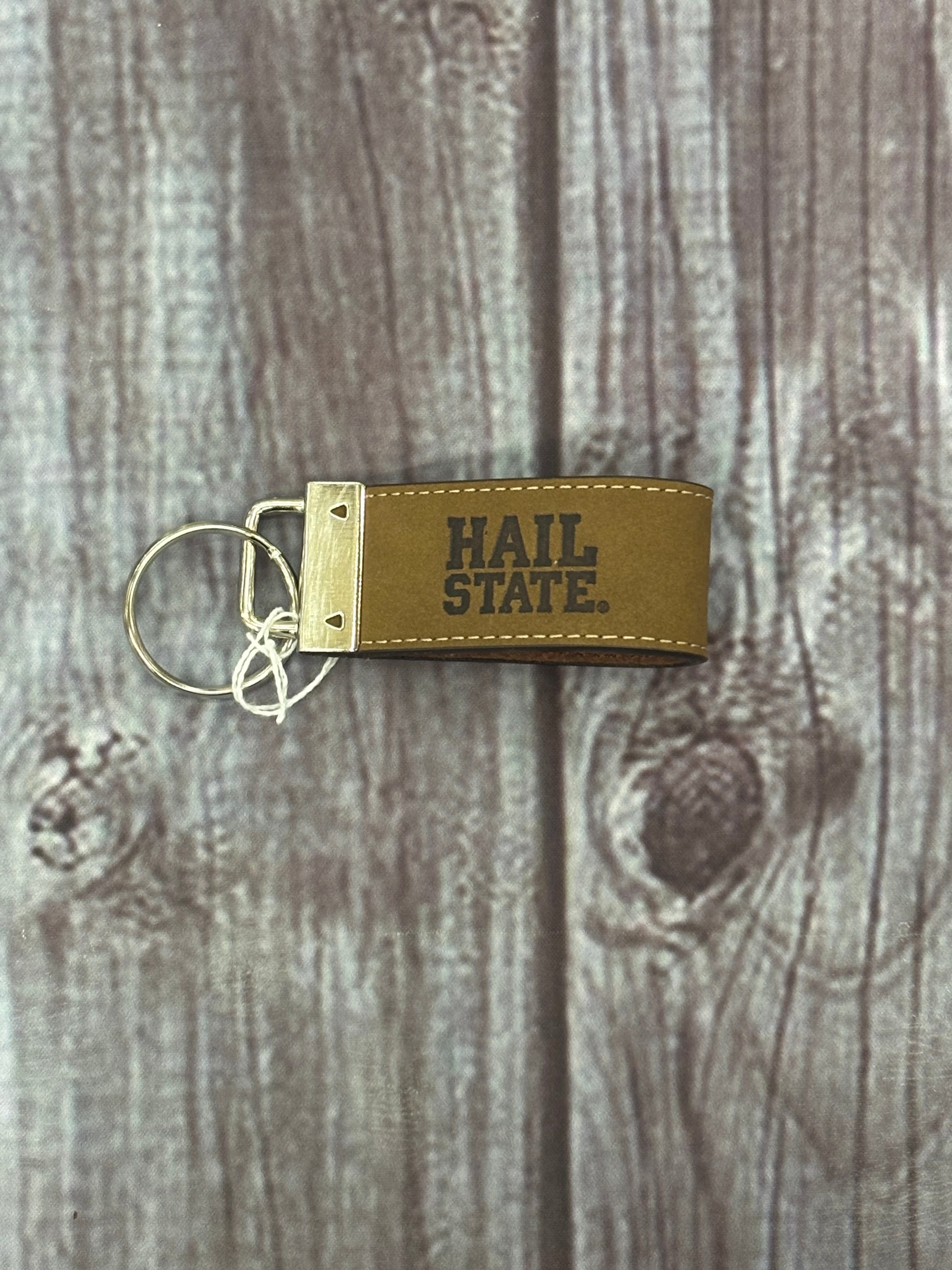 Divisions Of Zeppelin Products, Inc. Key Chain Fob Crazy Horse Hail State Emblemossed