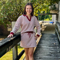 Women's Long Sleeve Collared Knit Striped Top And Skort Set